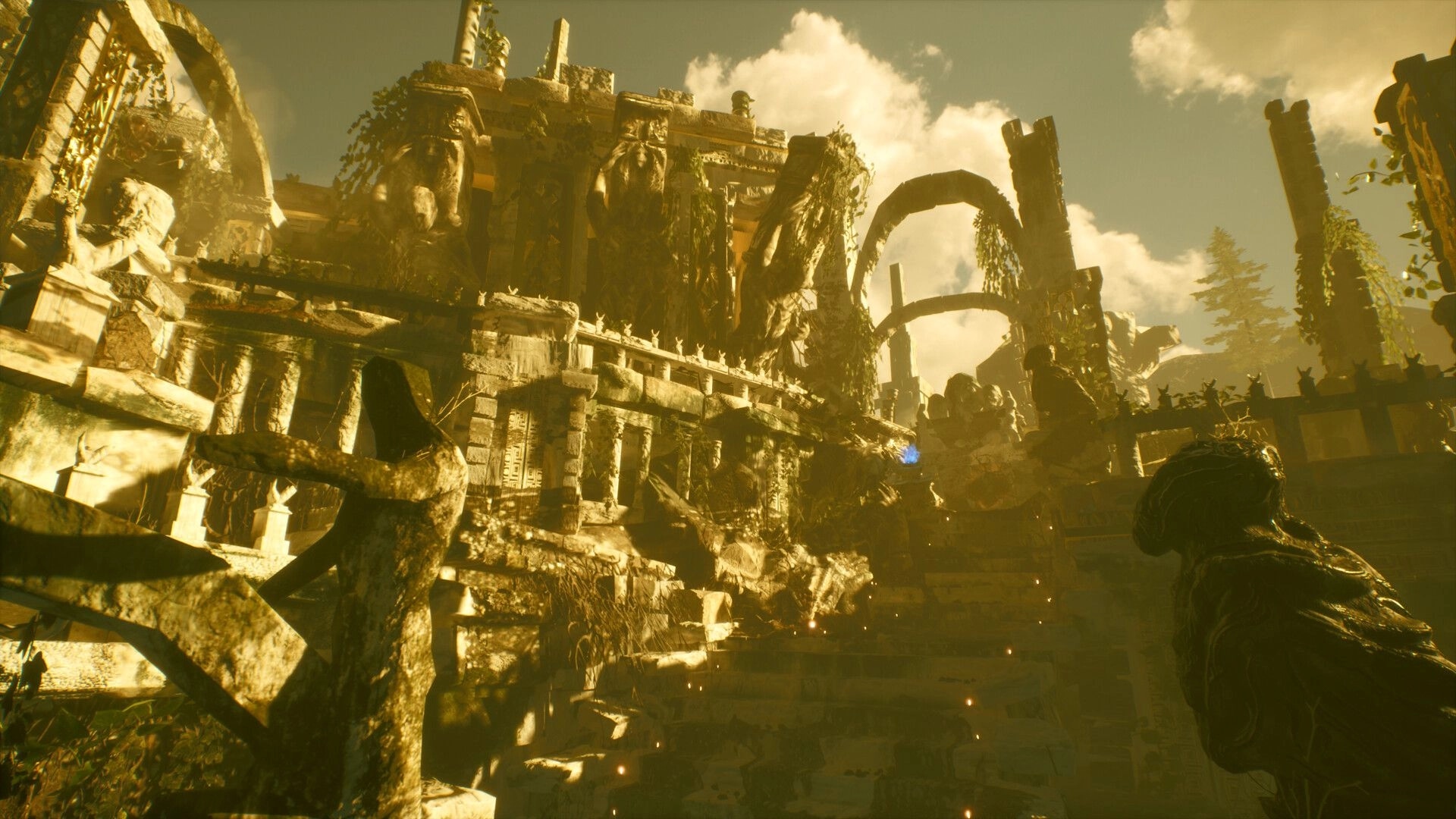 ASTHENIA: View up crumbling temple ruins with giant statues and broken arches under hazy golden sky.