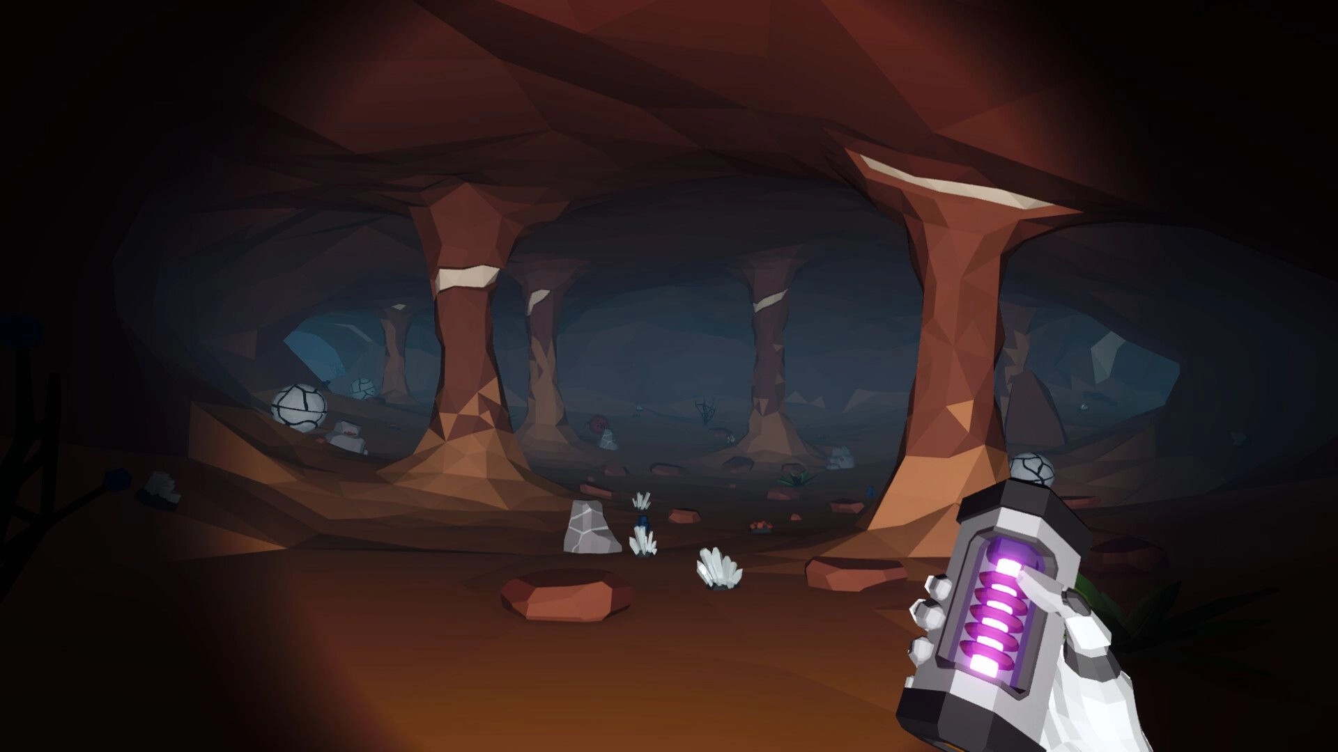 Astoaria: Exploring a dimly lit cave holding a glowing device, surrounded by rock formations