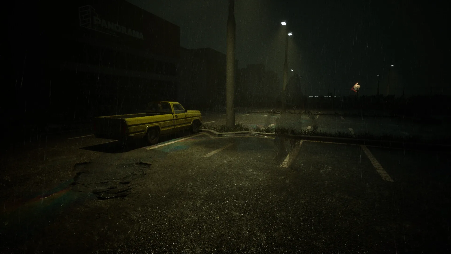 AUTO-CRISIS: Yellow truck parked under streetlights in a dark, rainy parking lot at night.