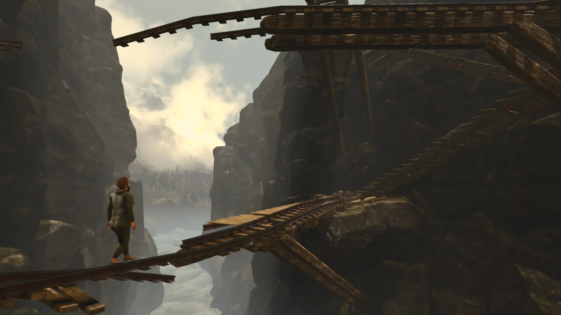 Baby Steps: Nate walking cautiously on a narrow, broken wooden bridge between steep rocky cliffs