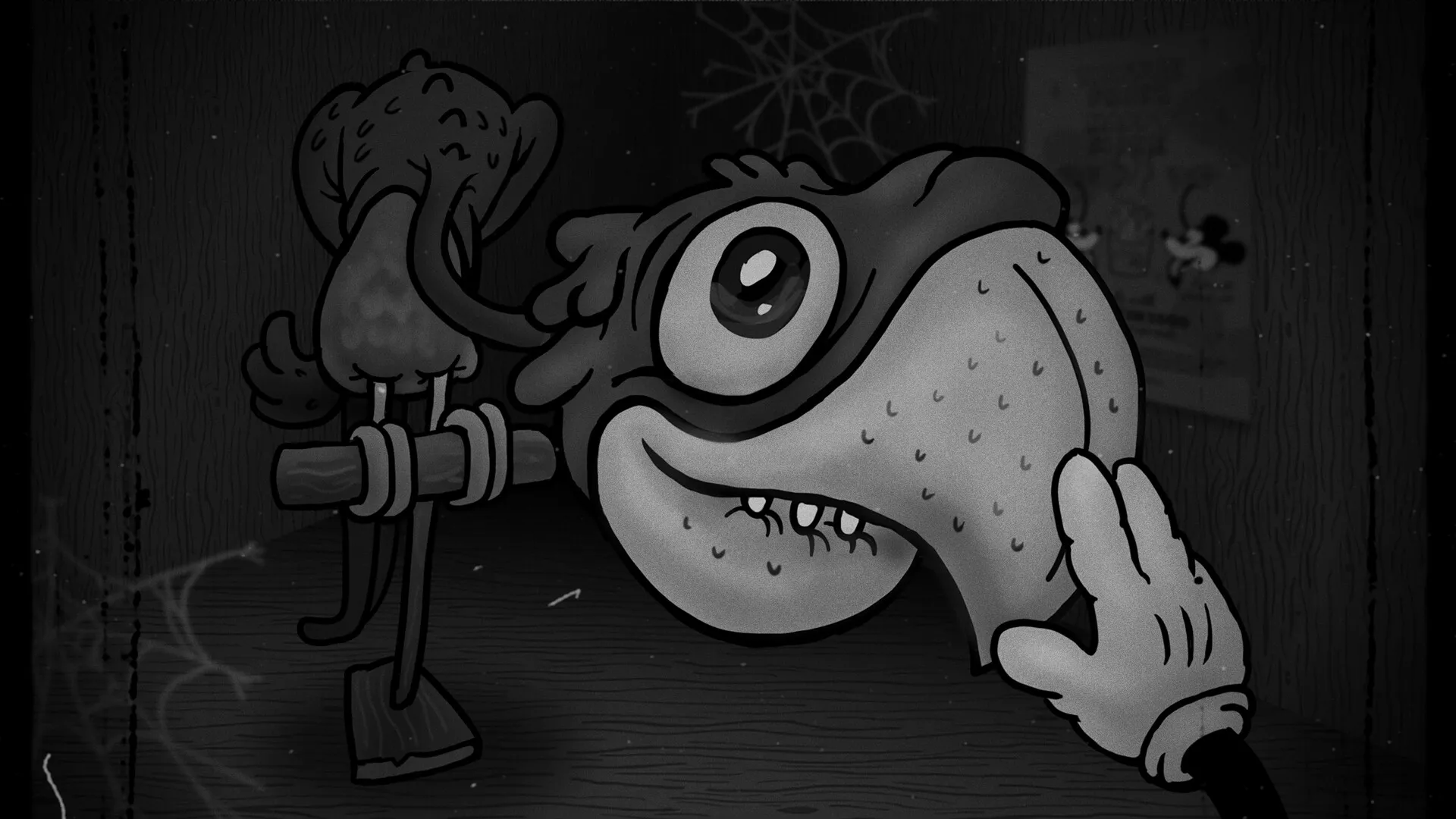 Bad Cheese: Close-up of a hand touching a large, eerie frog head in a dark, cobwebbed room.