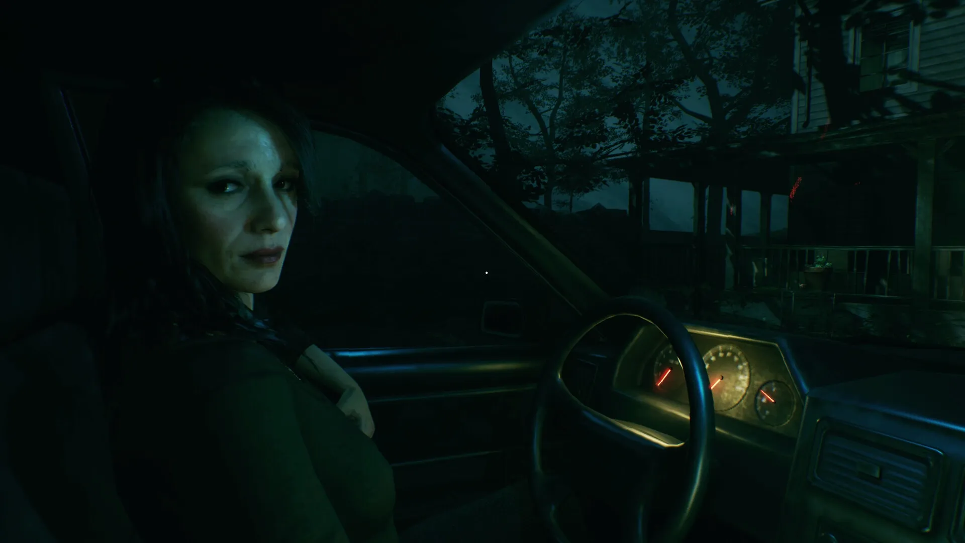 Baptiste: Woman in car at night, dashboard illuminated, eerie house visible through windshield