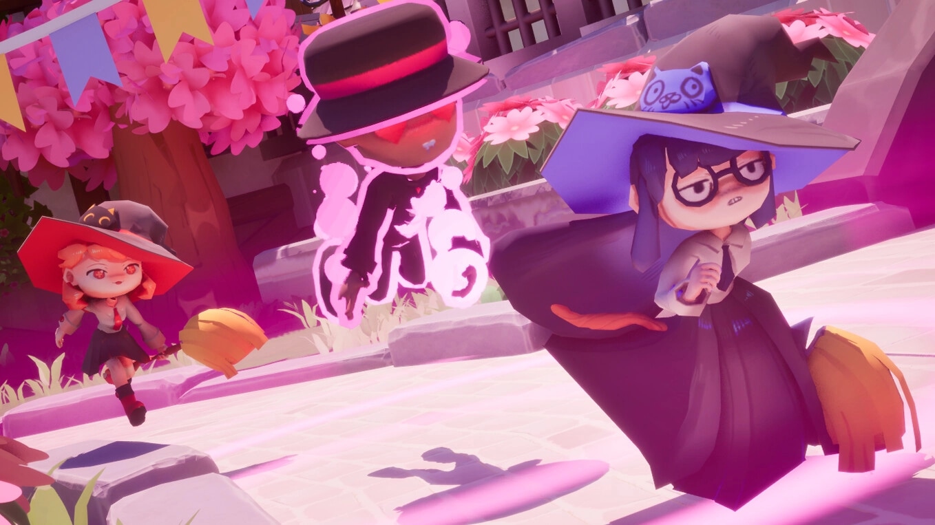 Bashful Adoration: Two witches race on brooms in a vibrant courtyard surrounded by pink blossoms.