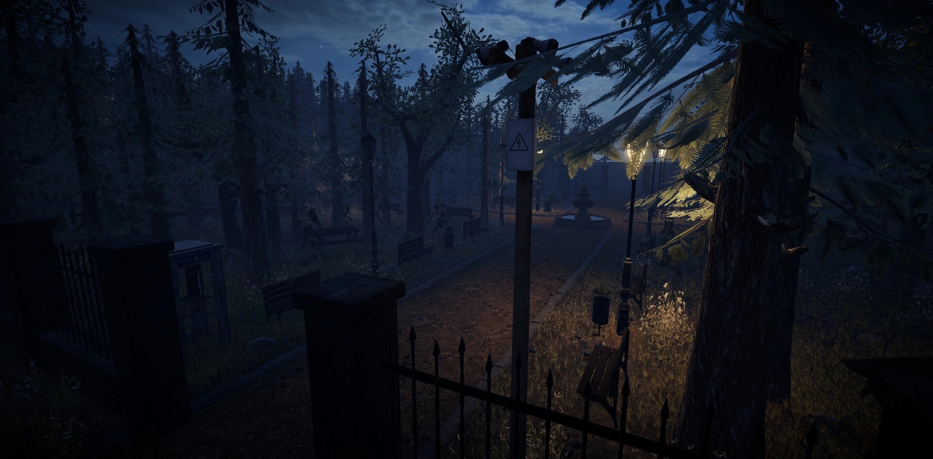 Bearstone Campsite: Dimly lit pathway with benches and a fountain amidst dense forest at night