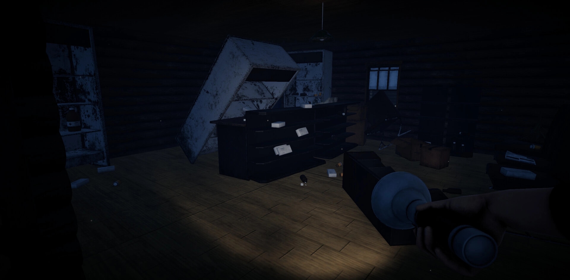 Bearstone Campsite: Player explores dark cabin with flashlight illuminating scattered supplies and debris