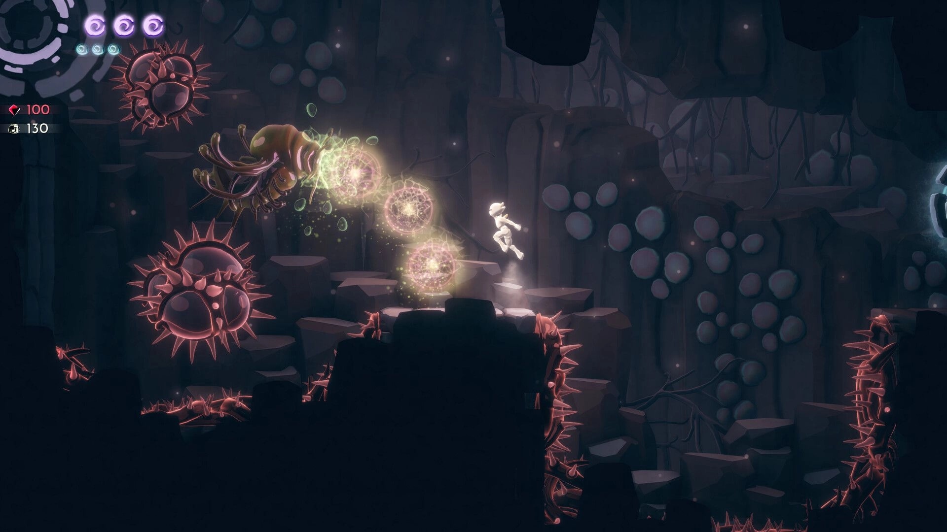Before I Go: Character jumping over spiked enemies in a dark cave with glowing health and mana UI.