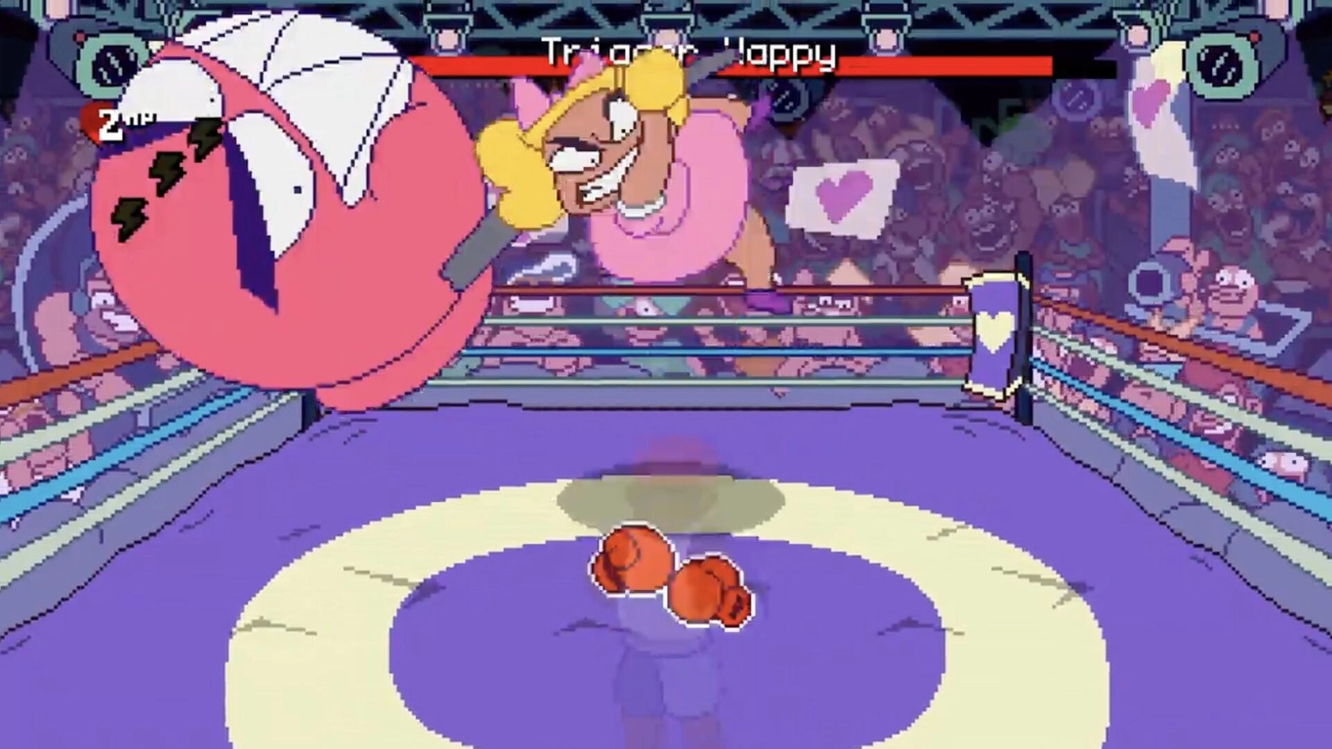 Big Boy Boxing: Boss fight as Trigger Happy swings a giant glove in a crowded boxing ring arena.