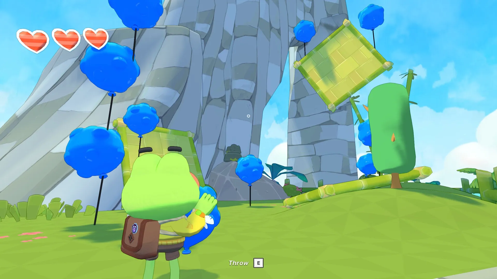 Big Hops: Frog character holding blue fruit near tall cliffs with hearts and "Throw E" UI element visible.