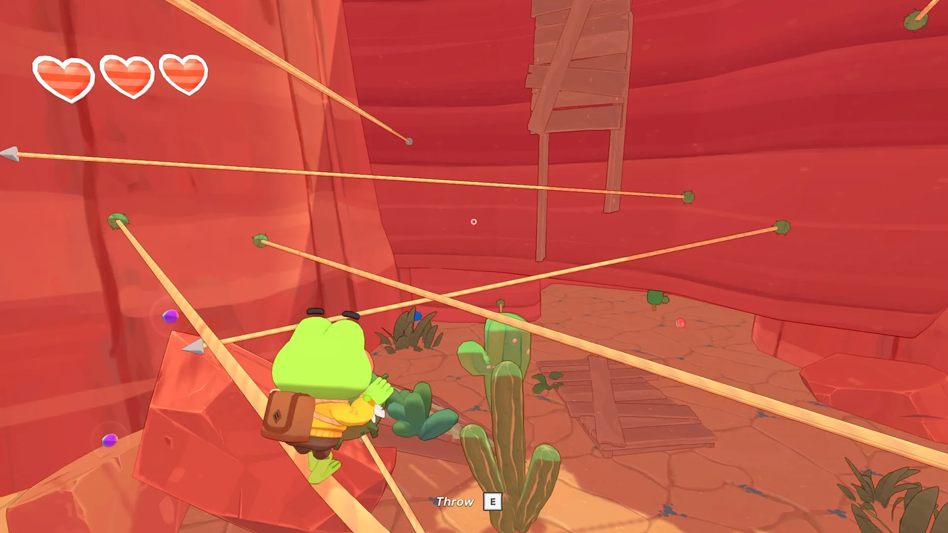 Big Hops: Frog character swinging on tightropes in a canyon setting with health hearts visible.