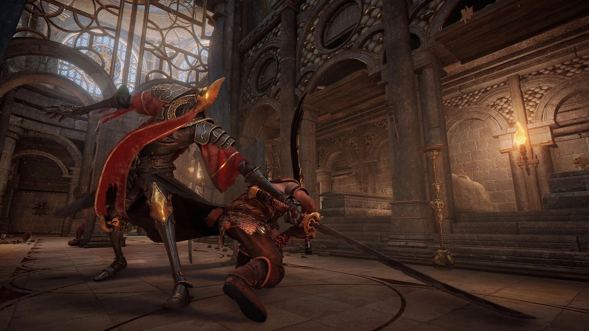 Blades of Fire: Armored warrior slashes a kneeling foe with a sword inside a torchlit stone hall.