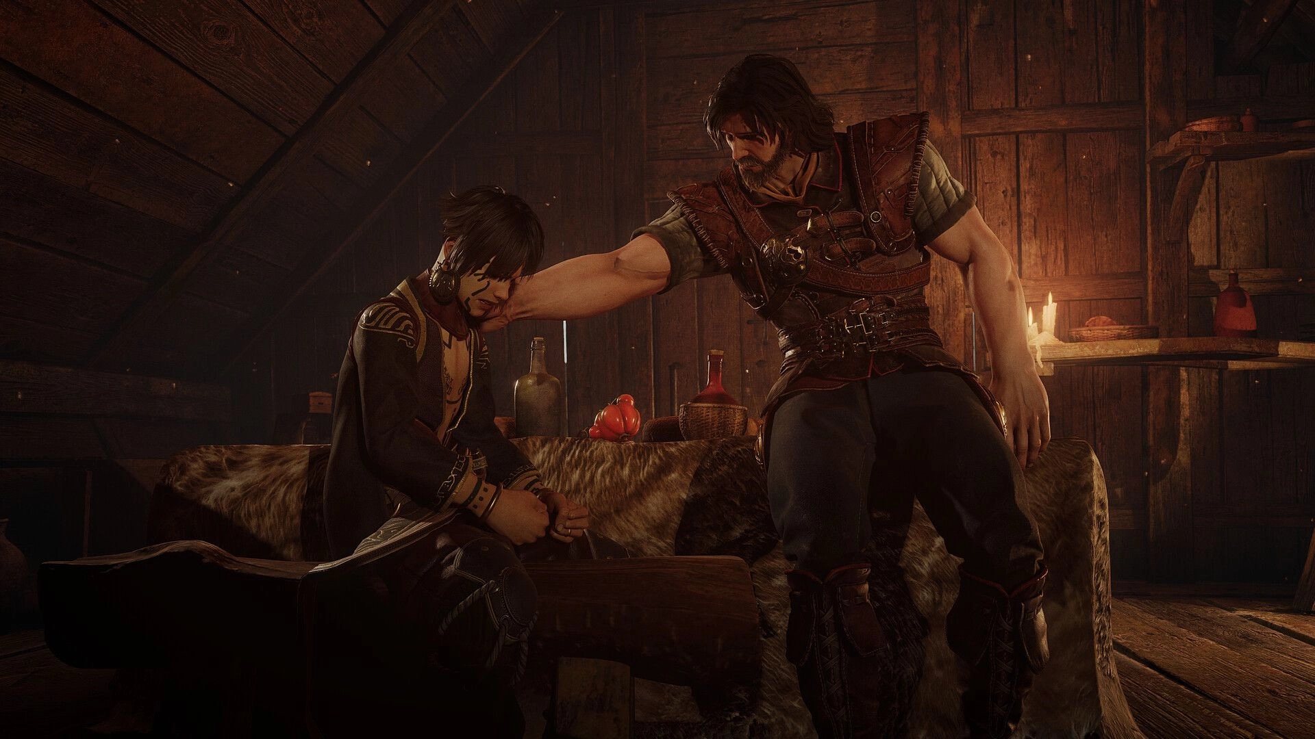 Blades of Fire: Armored man grabs a seated man's face in a dim wooden cabin with candles and bottles.