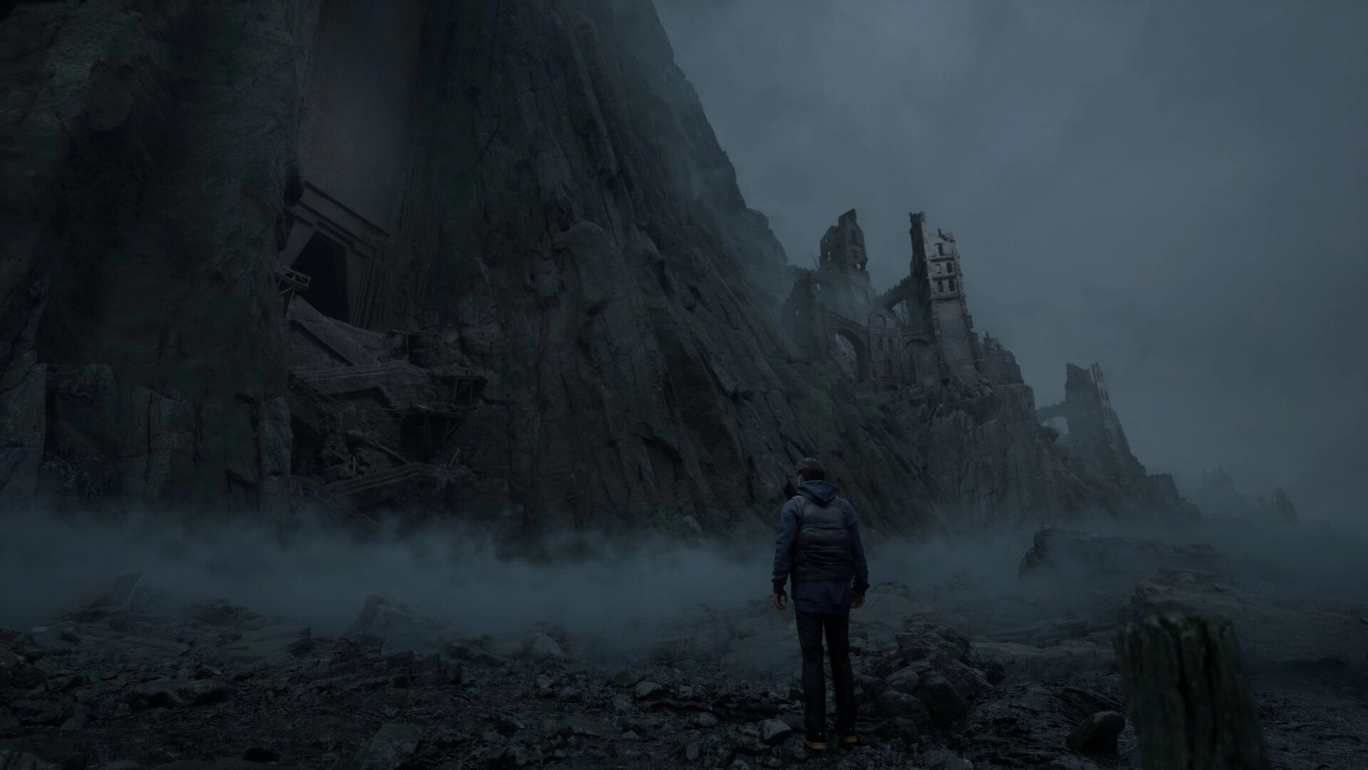 Bleak Haven: Lone figure explores misty ruins beneath towering cliffs in a desolate, eerie landscape.