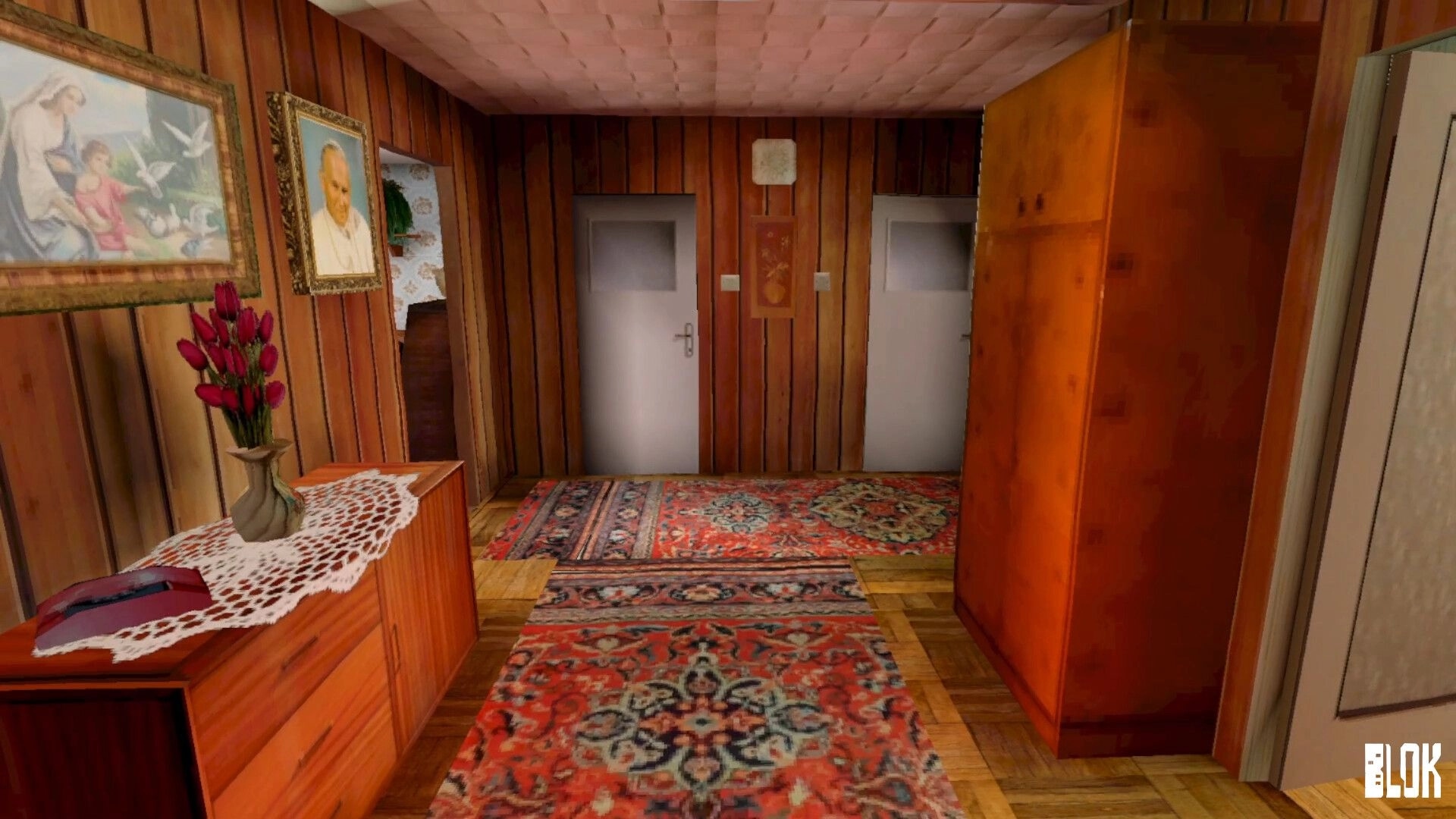BLOK: First-person view down wood-paneled hallway with rugs, wardrobe, and two closed doors ahead.