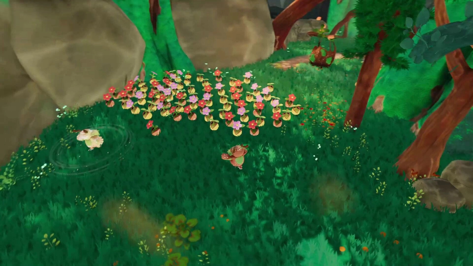 BloomKeeper: Pouic creatures gather by blooming flower patch in a grassy forest clearing near rocks.
