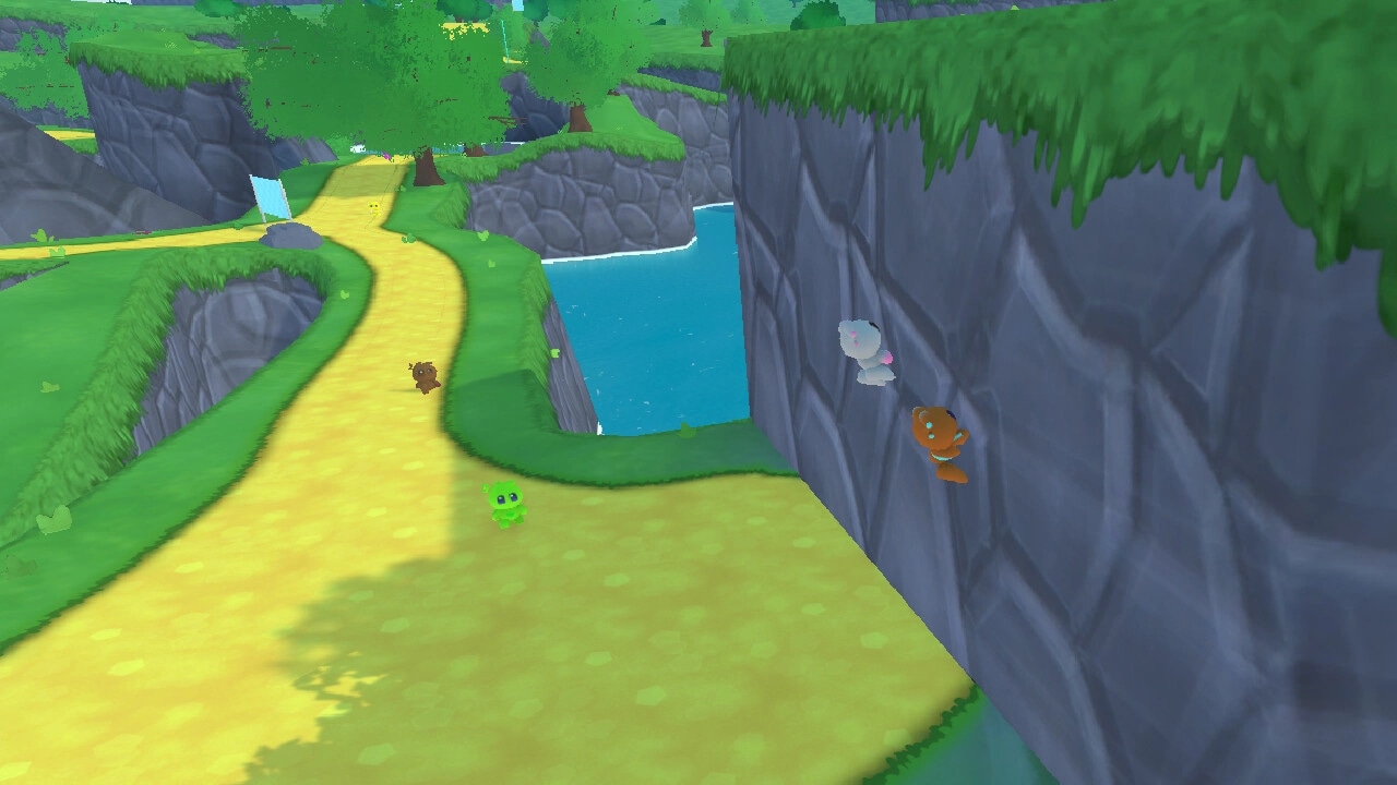 Bobo Bay: Creatures climbing a cliff in a lush, green valley with a winding path and river below