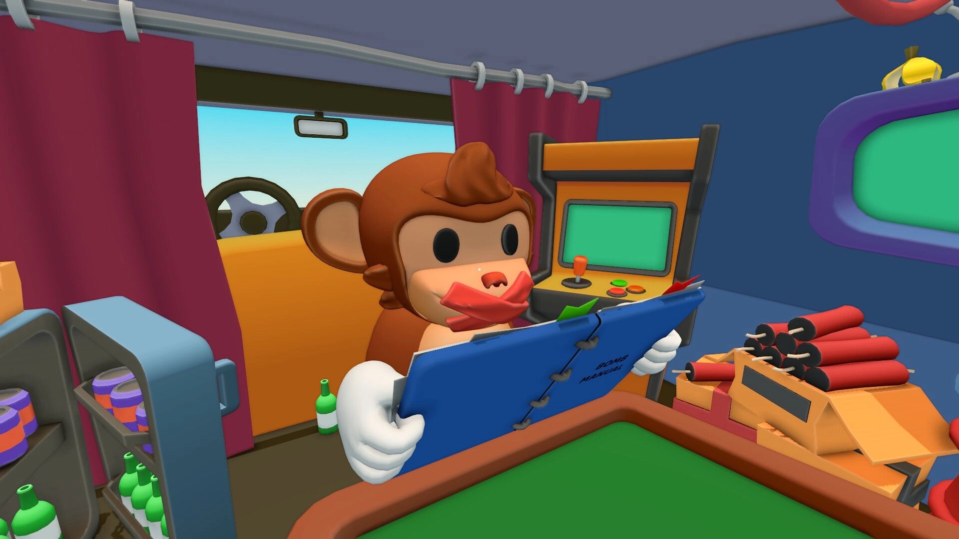 BOMBANANA!: Monkey with taped mouth reads bomb manual in a minivan workshop beside wires and screens.