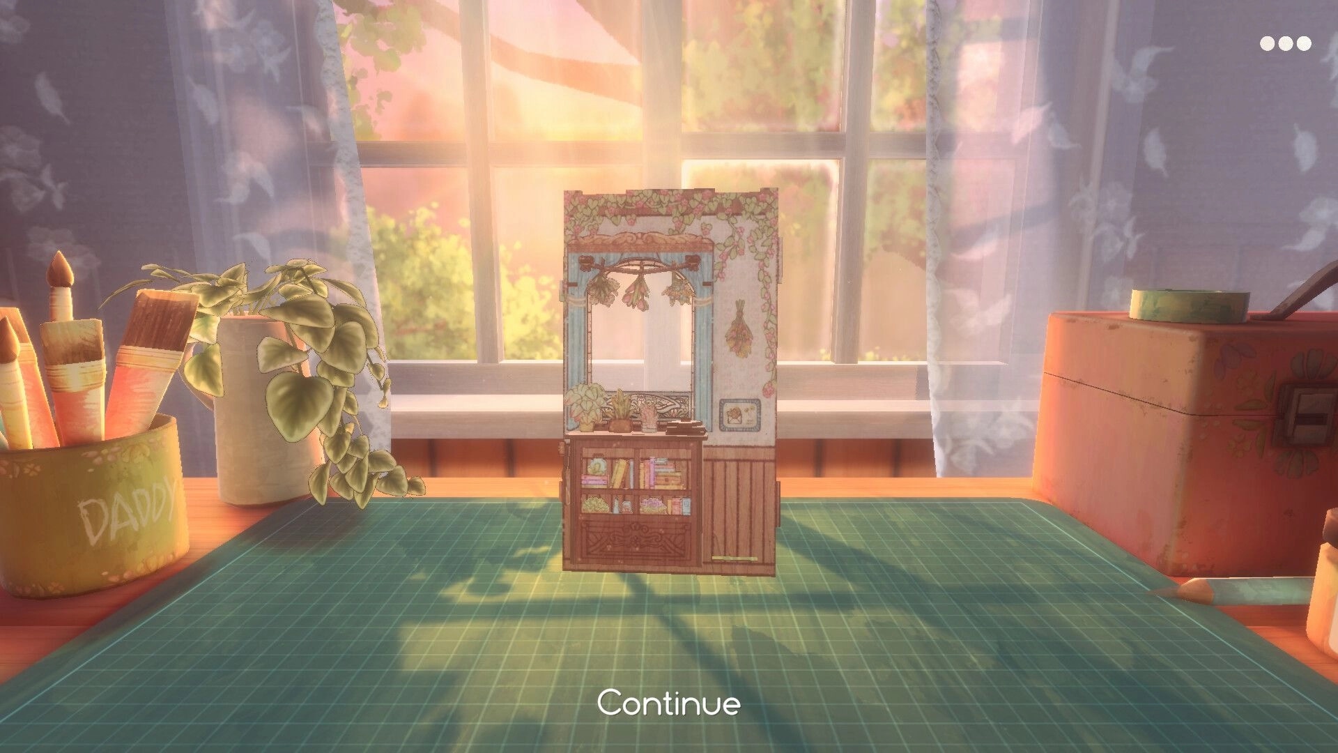 Book Nook: Continue screen with a tiny bookcase diorama on a craft mat by a sunlit window desk.