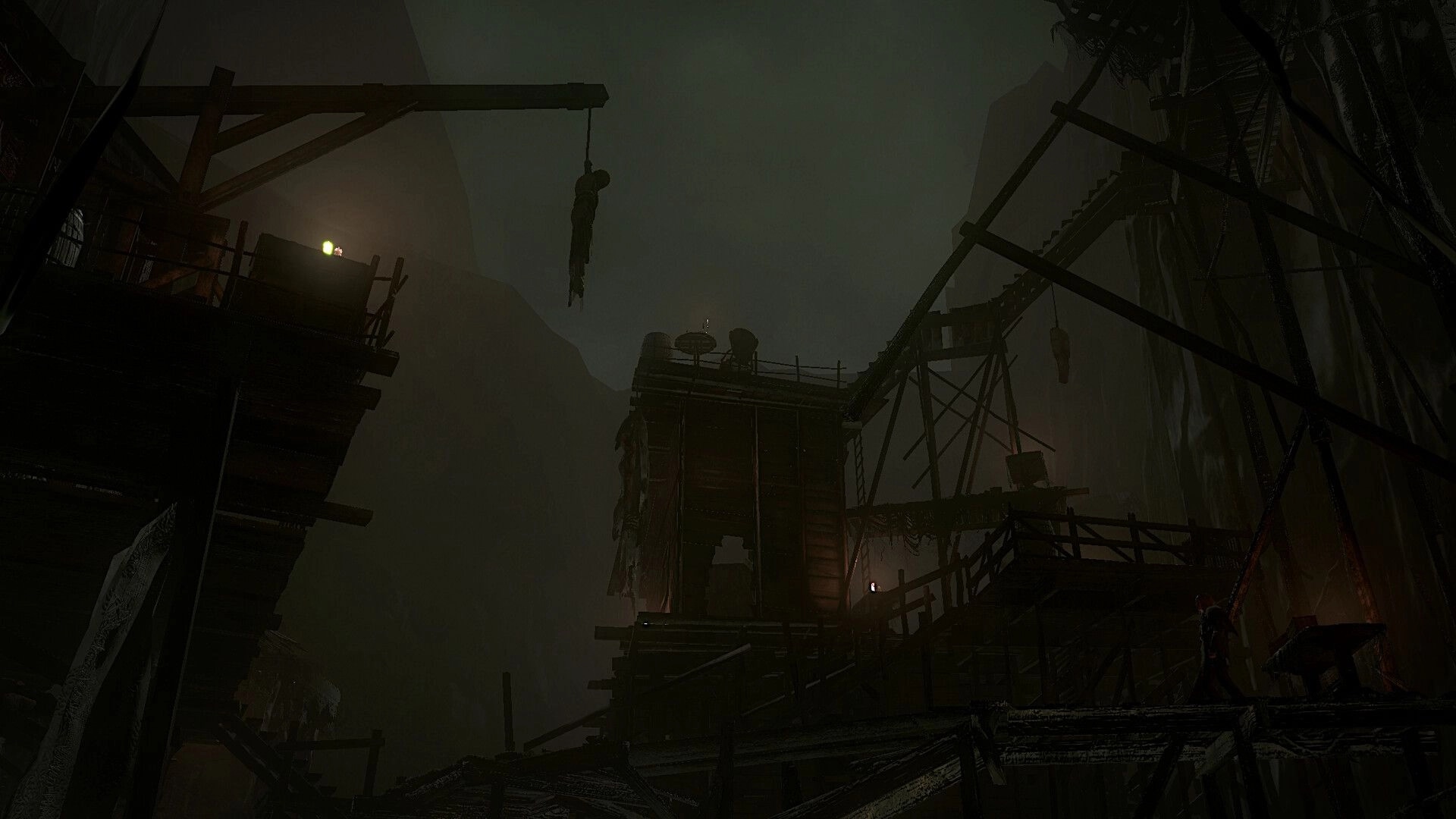 BRAMBLEFORT: Foggy cliffside scaffolding with hanging bodies and lanterns amid broken wooden walkways.