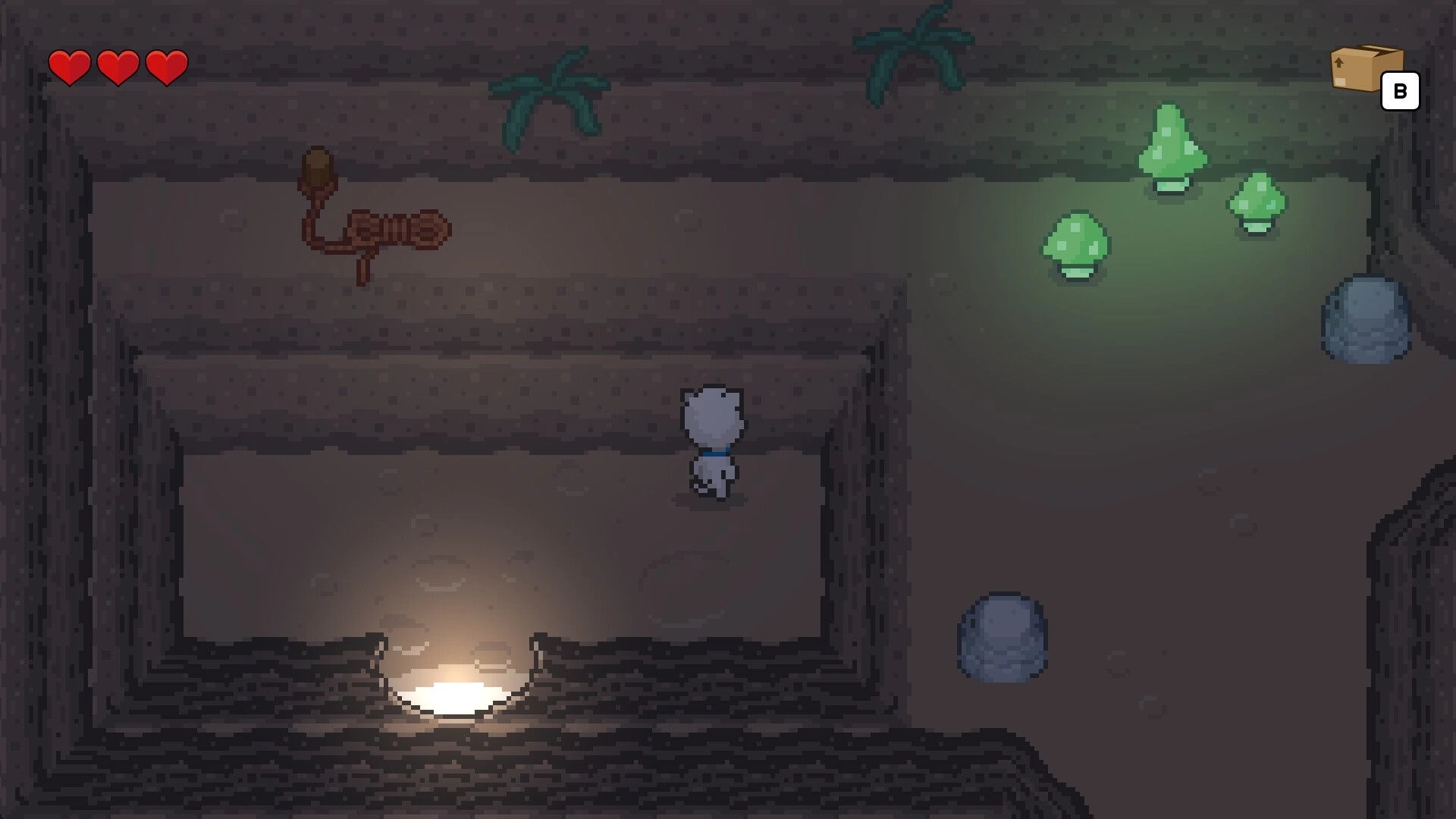 Bravest Coconut: Cat hero explores dim cave corridor with glowing mushrooms, hearts UI and box icon.