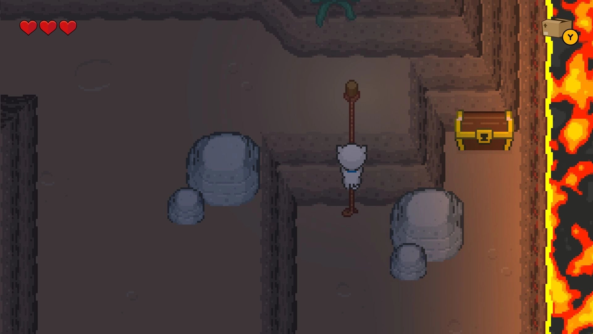 Bravest Coconut: Player climbs a rope ladder in a rocky cave, hearts UI and chest by lava edge.