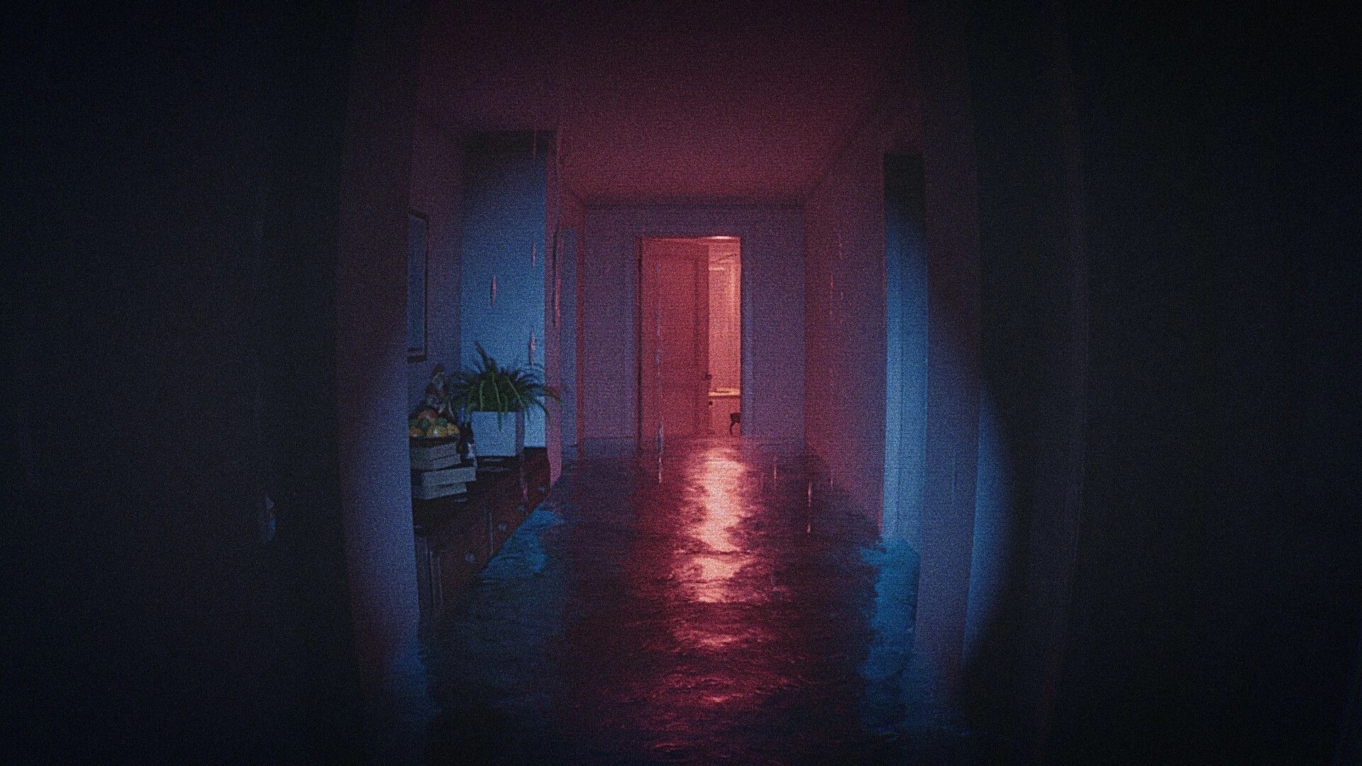 CAPTURED 2: First-person view down a flooded hallway toward an open door in a dim apartment corridor.