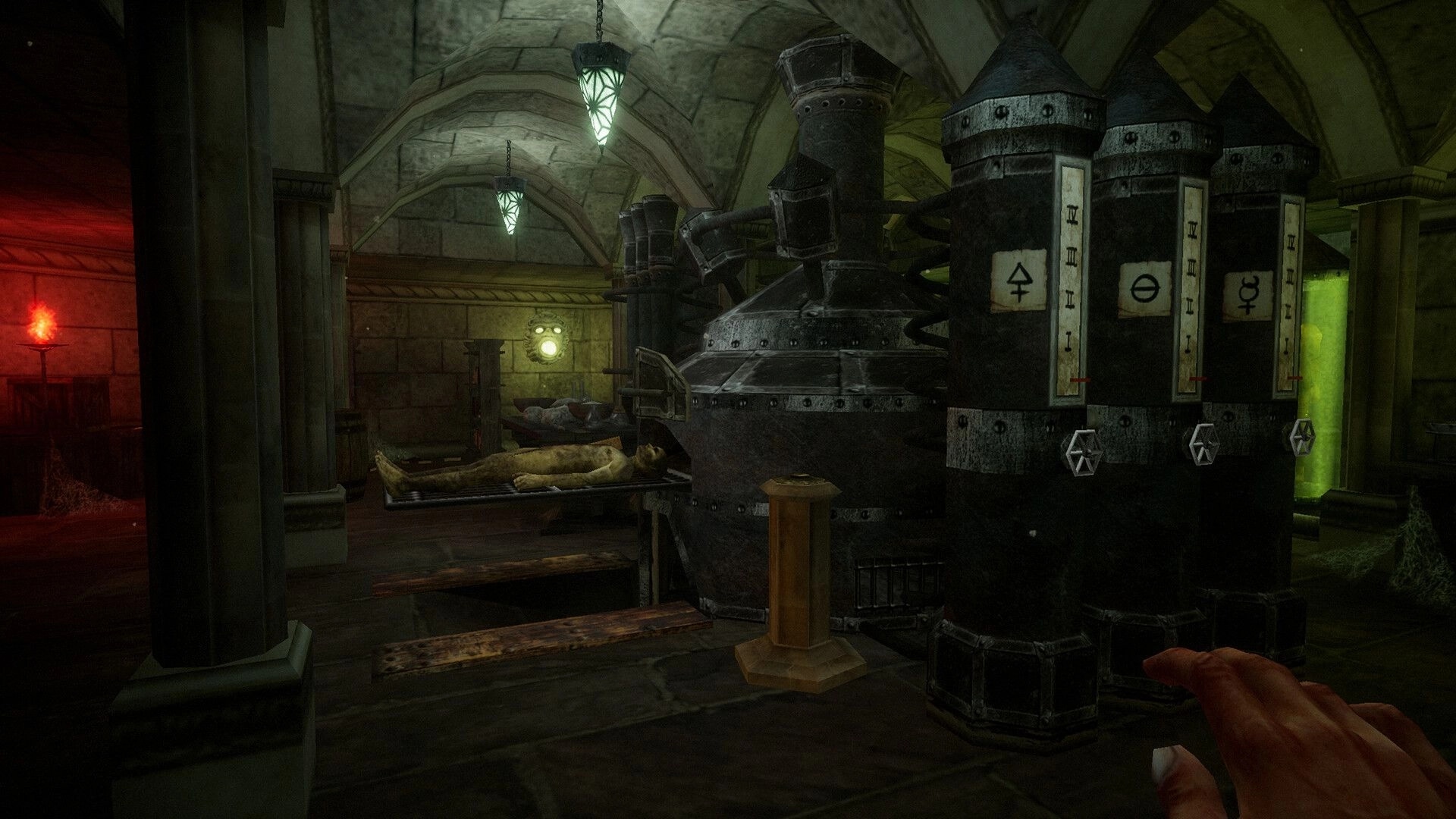 Caput Mortum: Player hand reaches towards alchemical machinery in dim, eerie stone chamber.