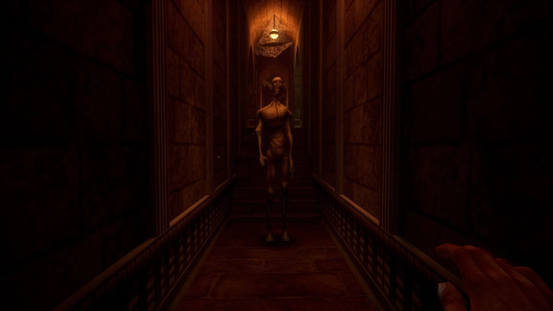 Caput Mortum: Eerie creature approaches player in dimly lit stone corridor of alchemist's tower