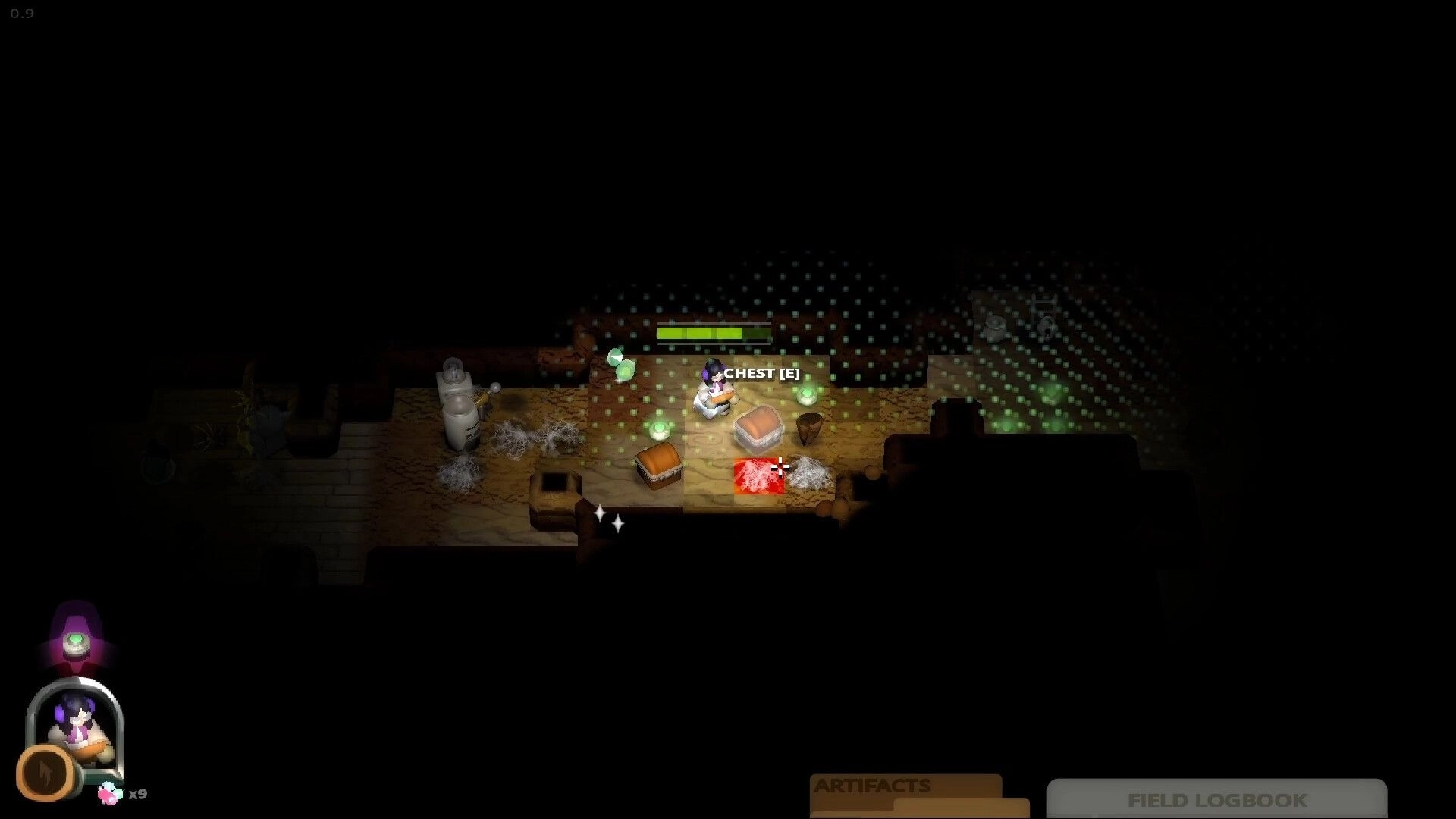 Cavern: Player stands by a chest prompt amid green wisps and cobwebs in a dim cavern room.