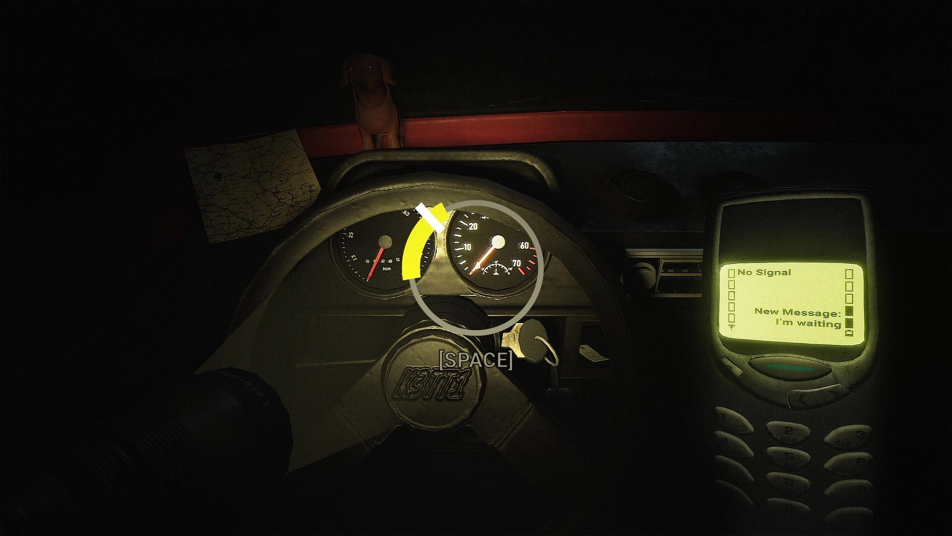 CH13: Driver view of car dashboard with steering wheel prompt and phone reading "I'm waiting" at night.