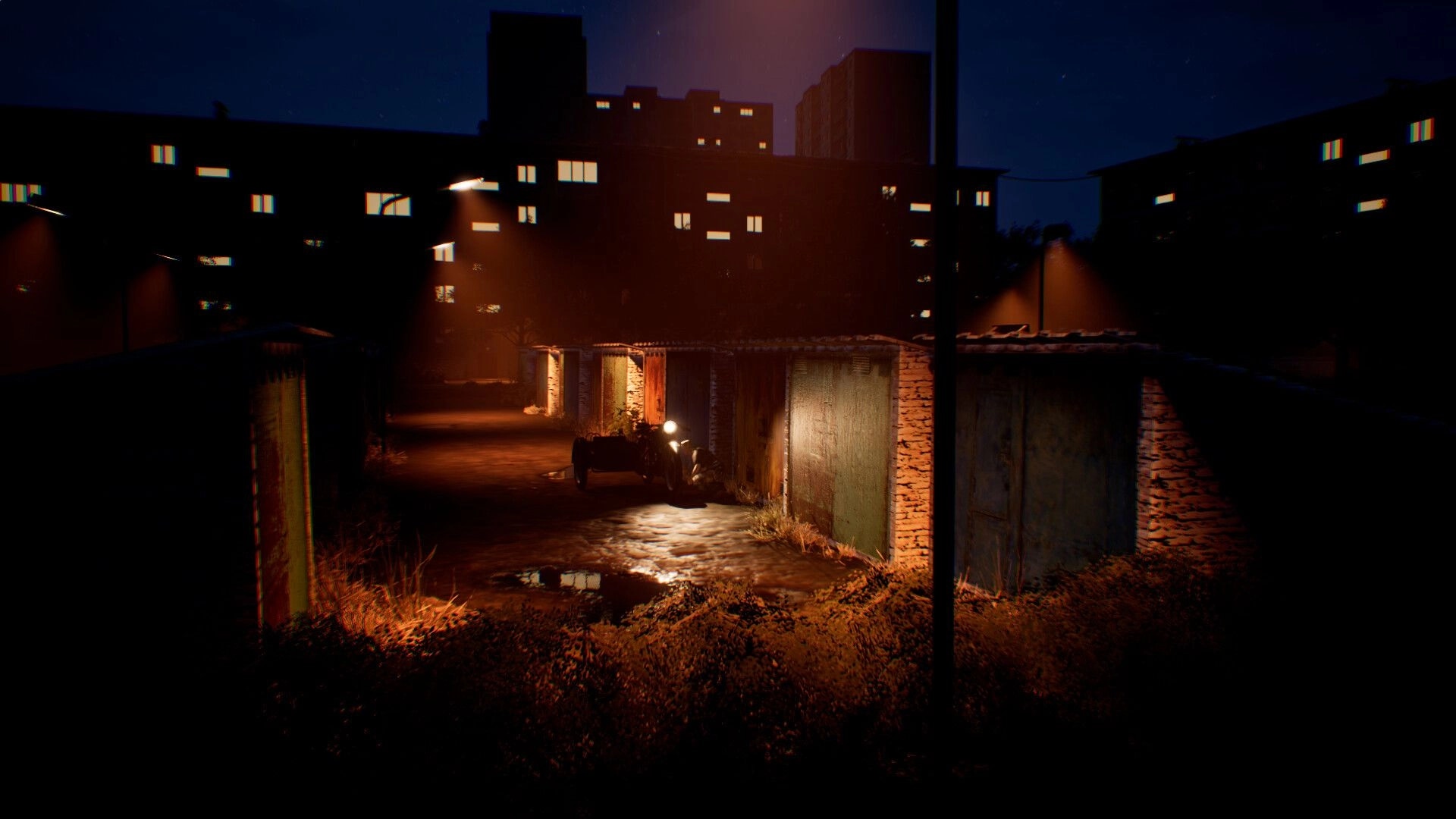 Change: Nighttime alley with garage doors and puddles lit by streetlamps beneath apartment blocks.