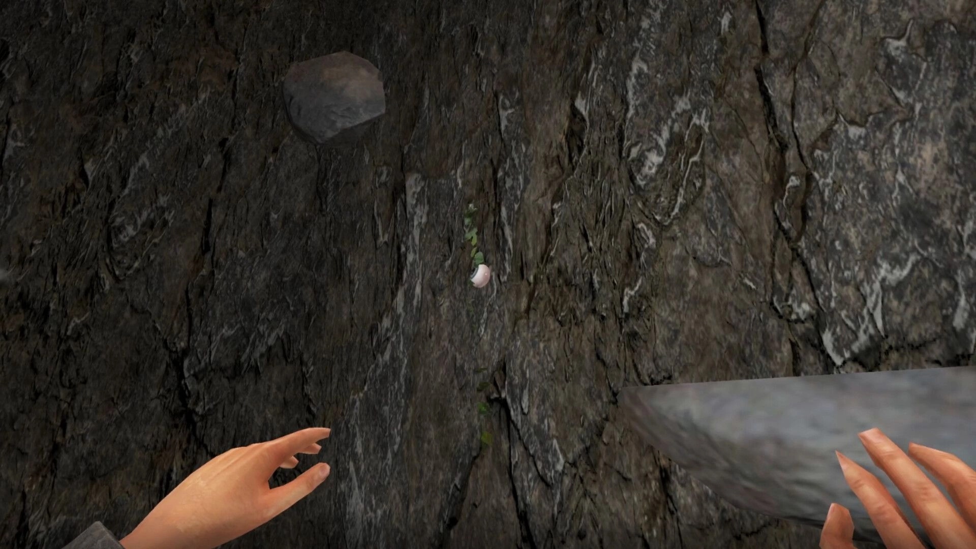 Cobble Climber: First-person hands reaching for a small hold on a steep rocky cliff face outdoors.