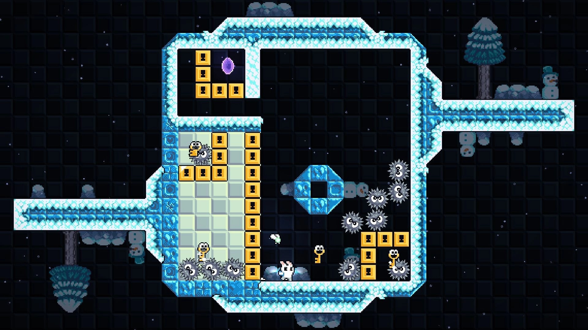 Coco’s Revenge: Bunny dodges spiky enemies and key blocks in an icy, rotating maze level.