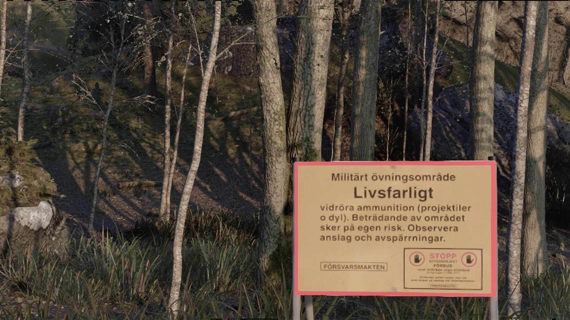 Cold Response: Swedish military danger warning sign posted at edge of a rocky forest clearing.