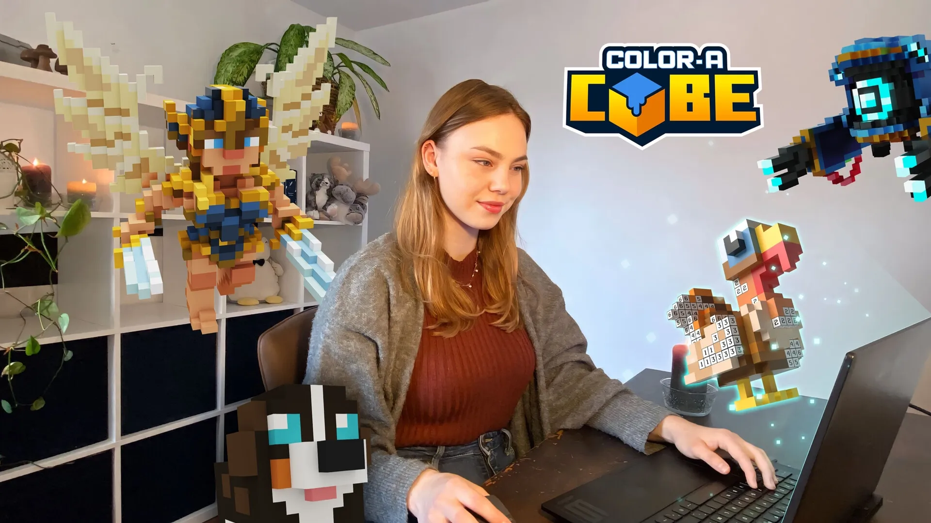 Color-A-Cube: Player interacting with voxel characters on a laptop in a cozy room setting