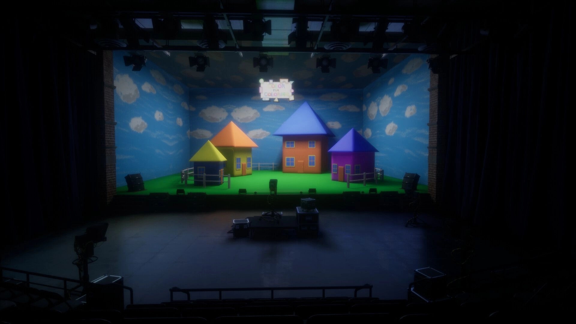 Color Fear: Brightly colored houses on stage set with cloud backdrop in dark studio setting