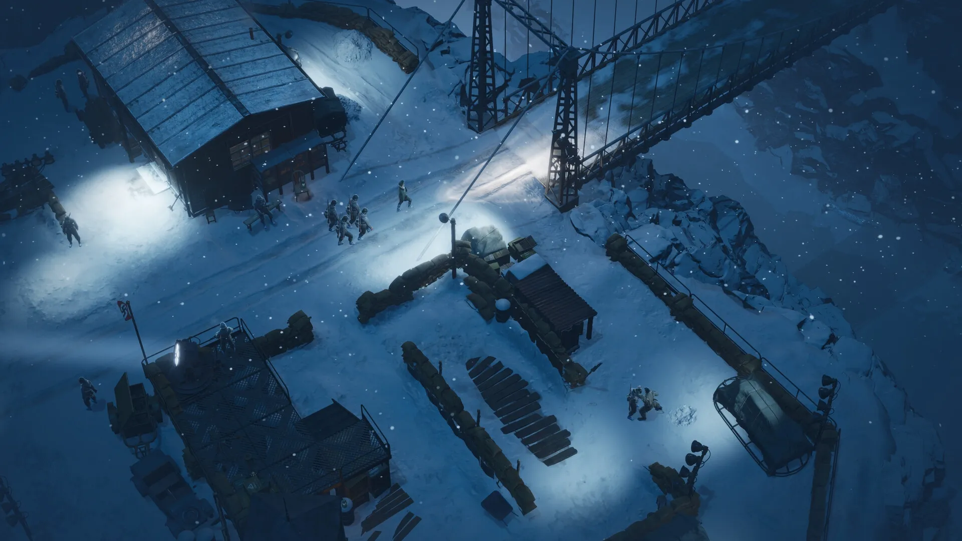 Commandos: Soldiers patrolling snowy military base at night near a bridge with searchlights illuminating area