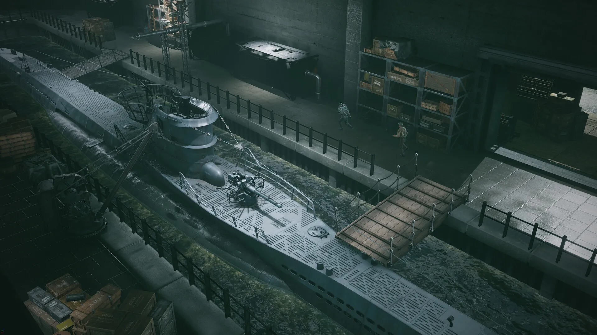 Commandos: Two characters sneaking near a submarine in a dimly lit dock with crates and equipment nearby