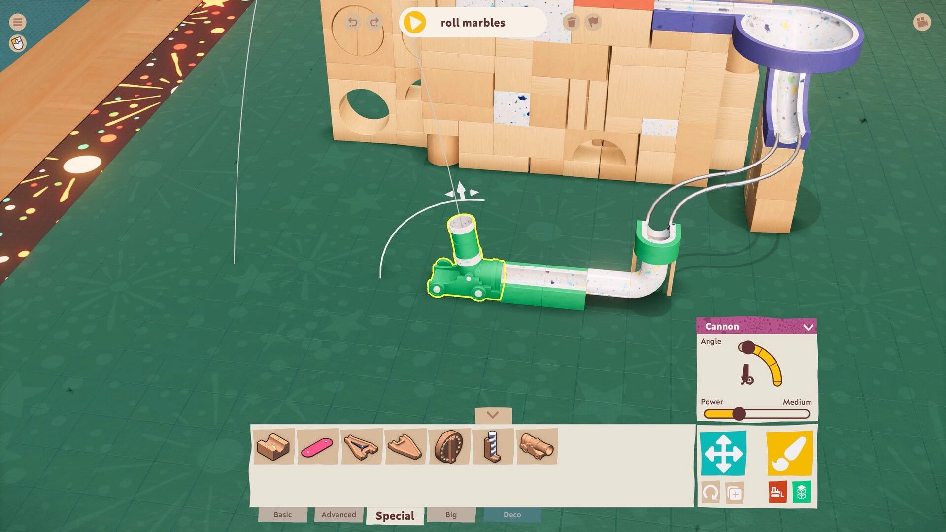 Cozy Marbles: Marble cannon placement with control panel on green grid in block-filled workshop