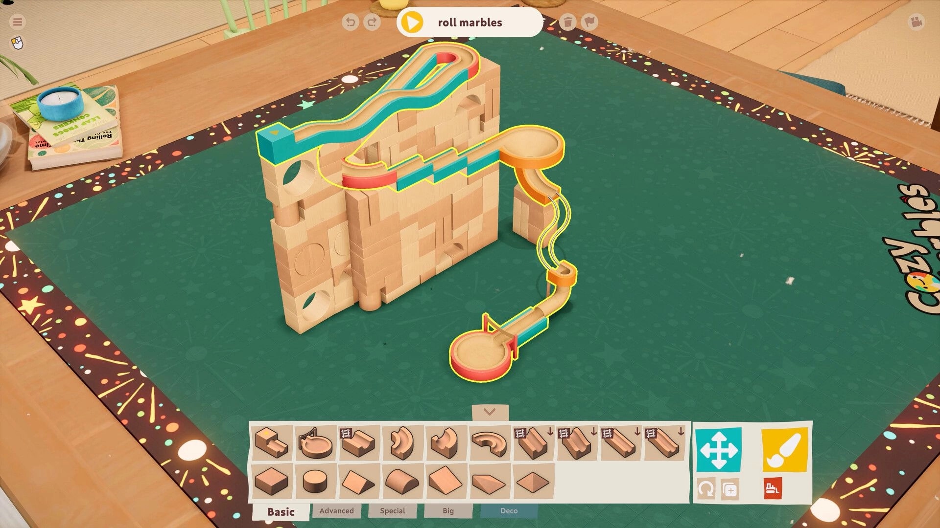 Cozy Marbles: Wooden marble run with colorful tracks on a tabletop, UI shows track pieces selection
