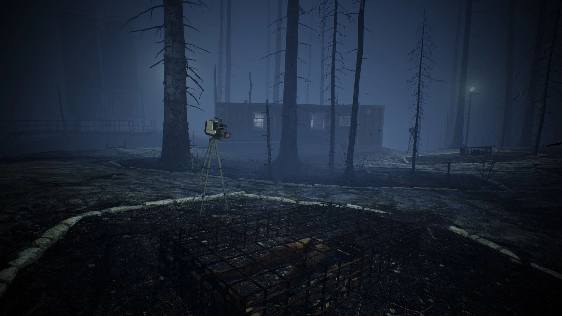 Dark Fracture: Old camera on tripod near eerie forest cabin at night in foggy, desolate setting.