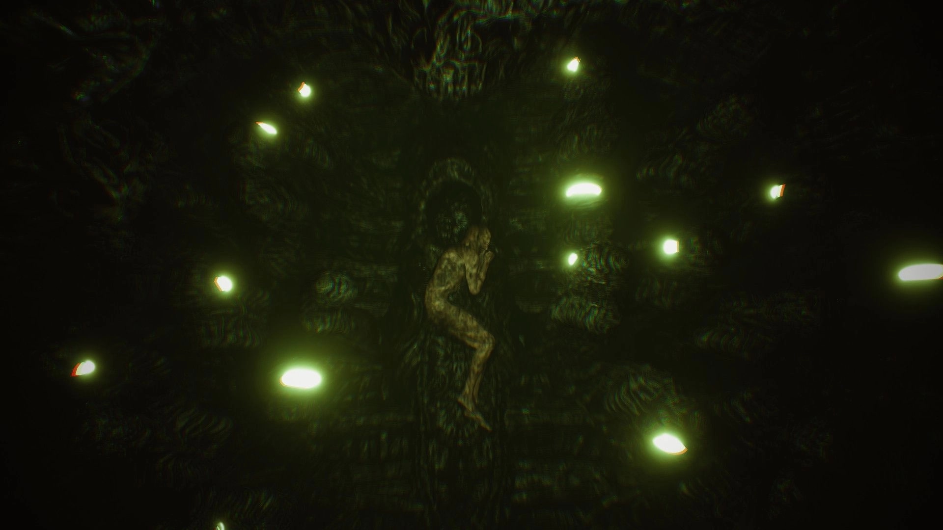 Dark Fracture: Fetal position figure surrounded by eerie green lights in a dark, cavernous environment