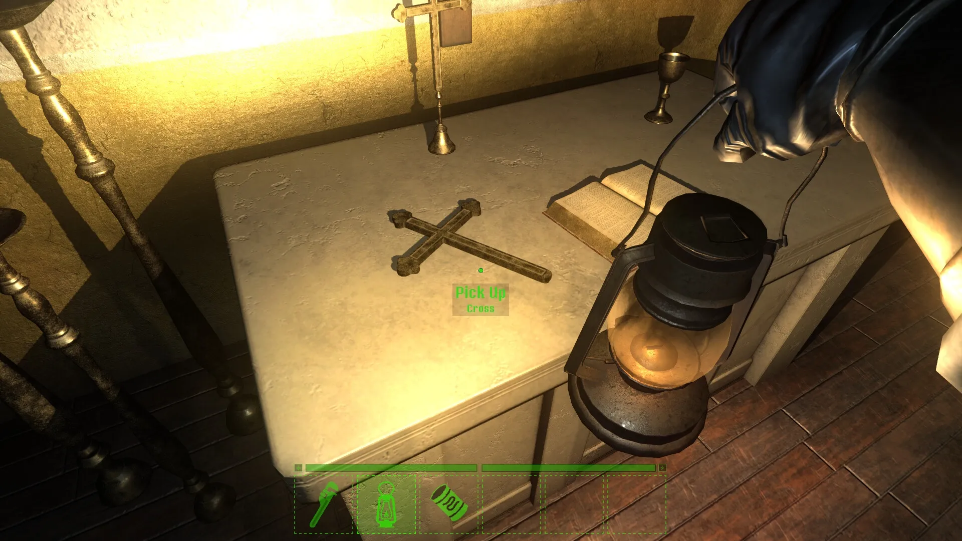 Darkwater: Player holds lantern near table with cross and book, pick-up prompt visible in dim room