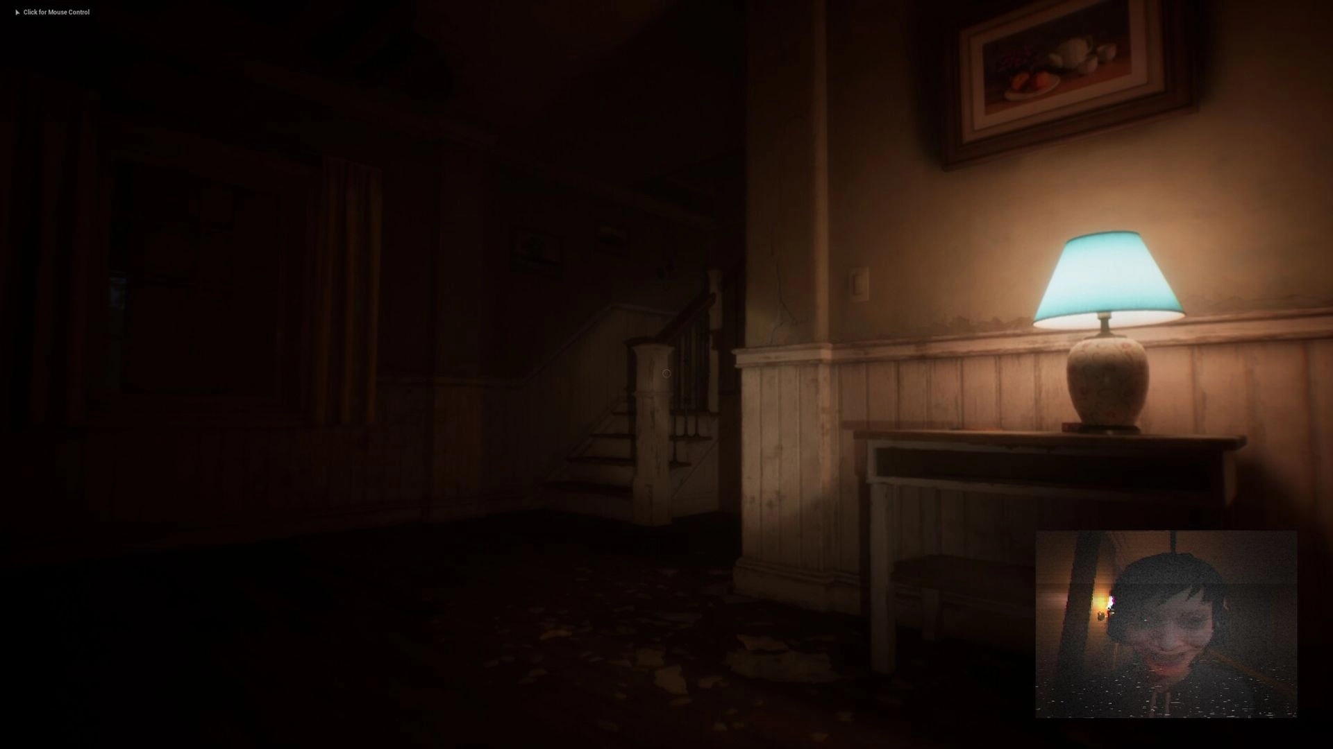 Deadcam: Dimly lit hallway with staircase; Margo's eerie headcam feed in bottom right corner.