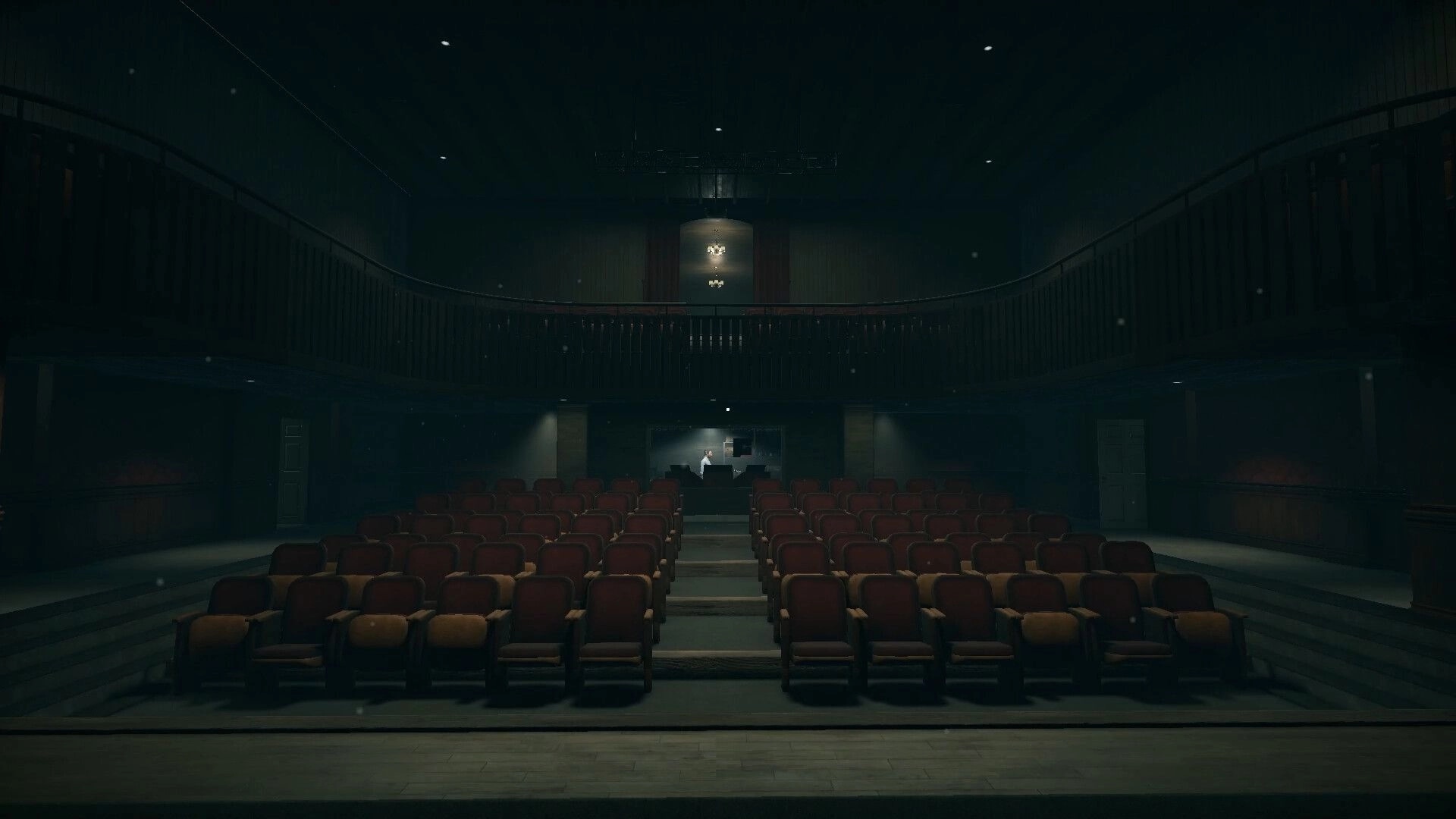 Deadly Rehearsal: Empty theater with dim lighting, focusing on stage and rows of red velvet seats