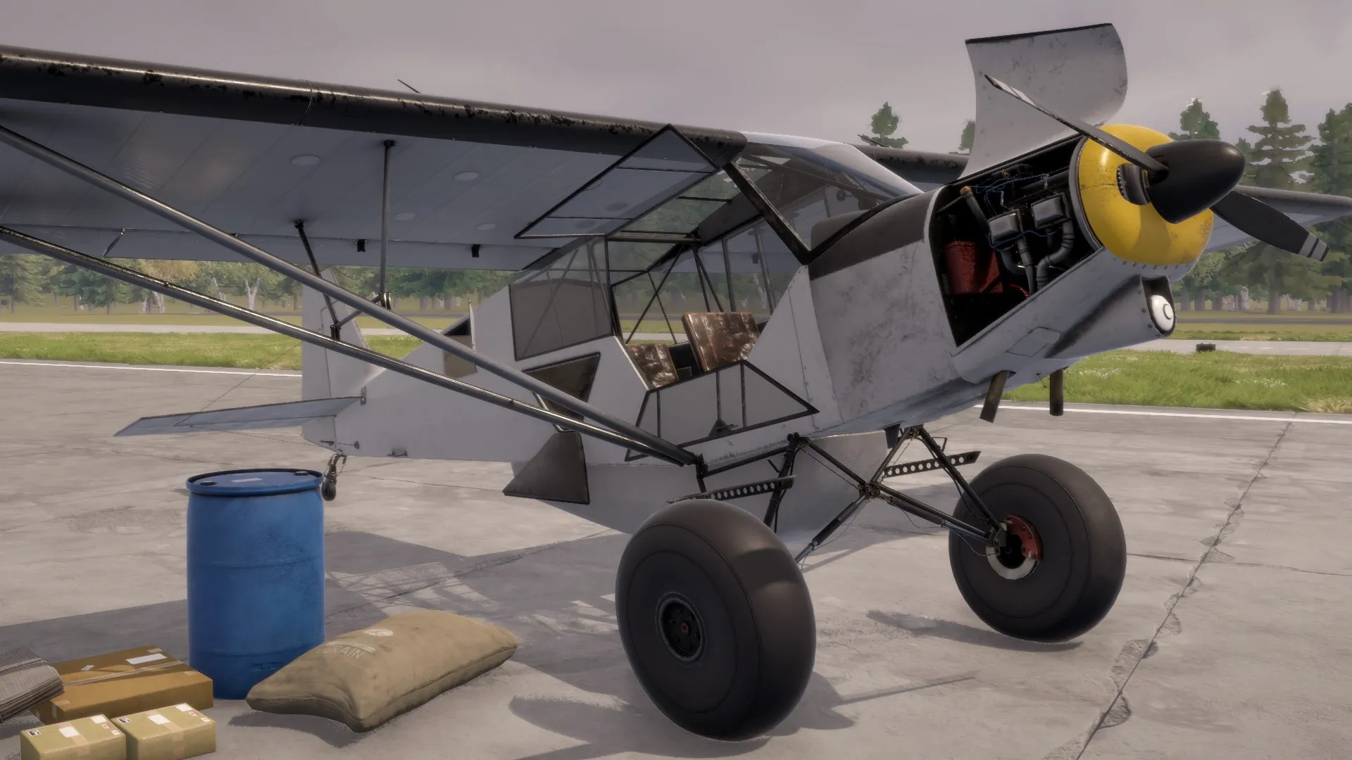Deadstick: Small bush plane parked on runway with open engine cover, surrounded by cargo and supplies