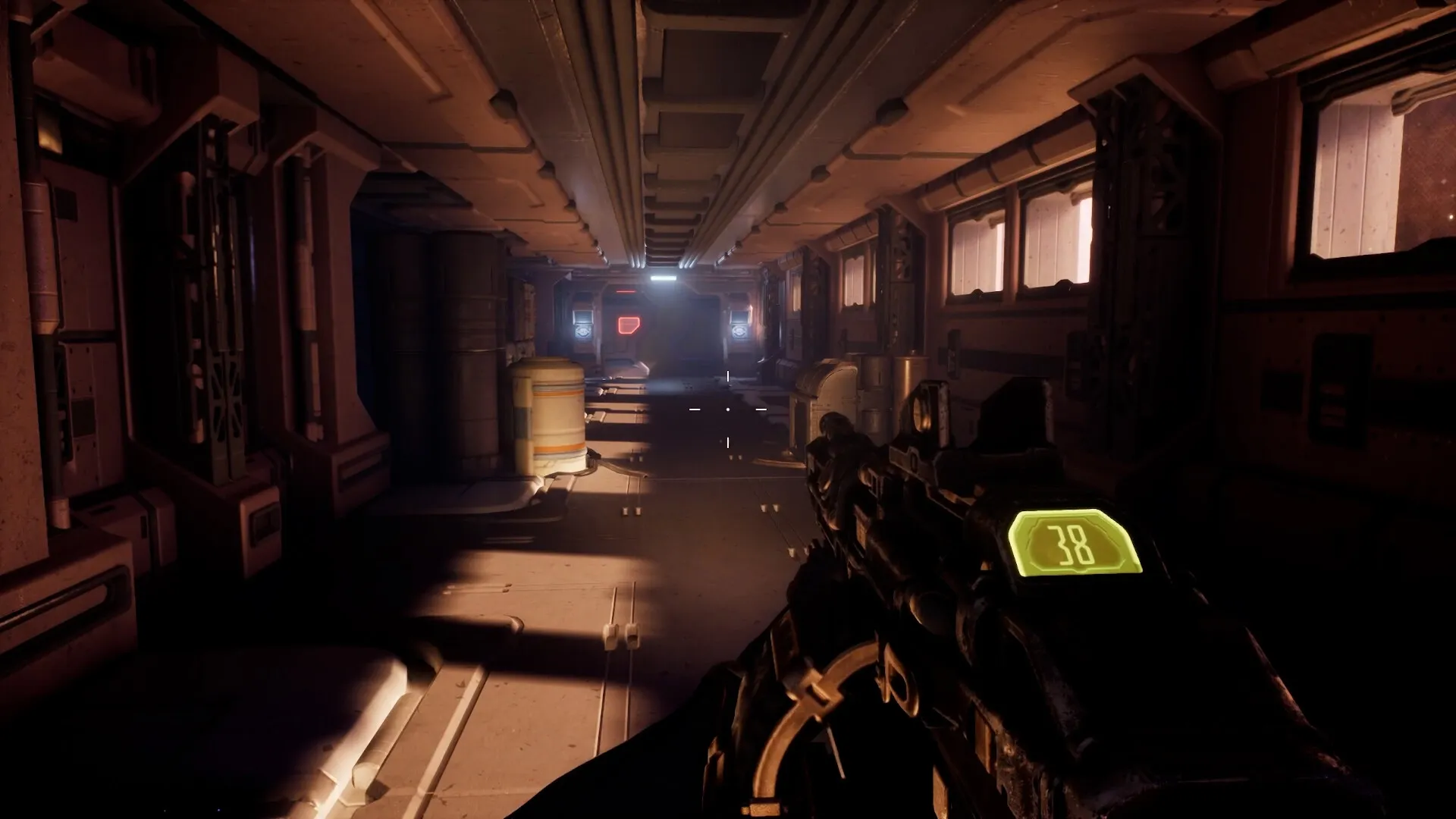 Deadzone: First-person view in dimly lit space corridor with weapon HUD showing ammo count of 38