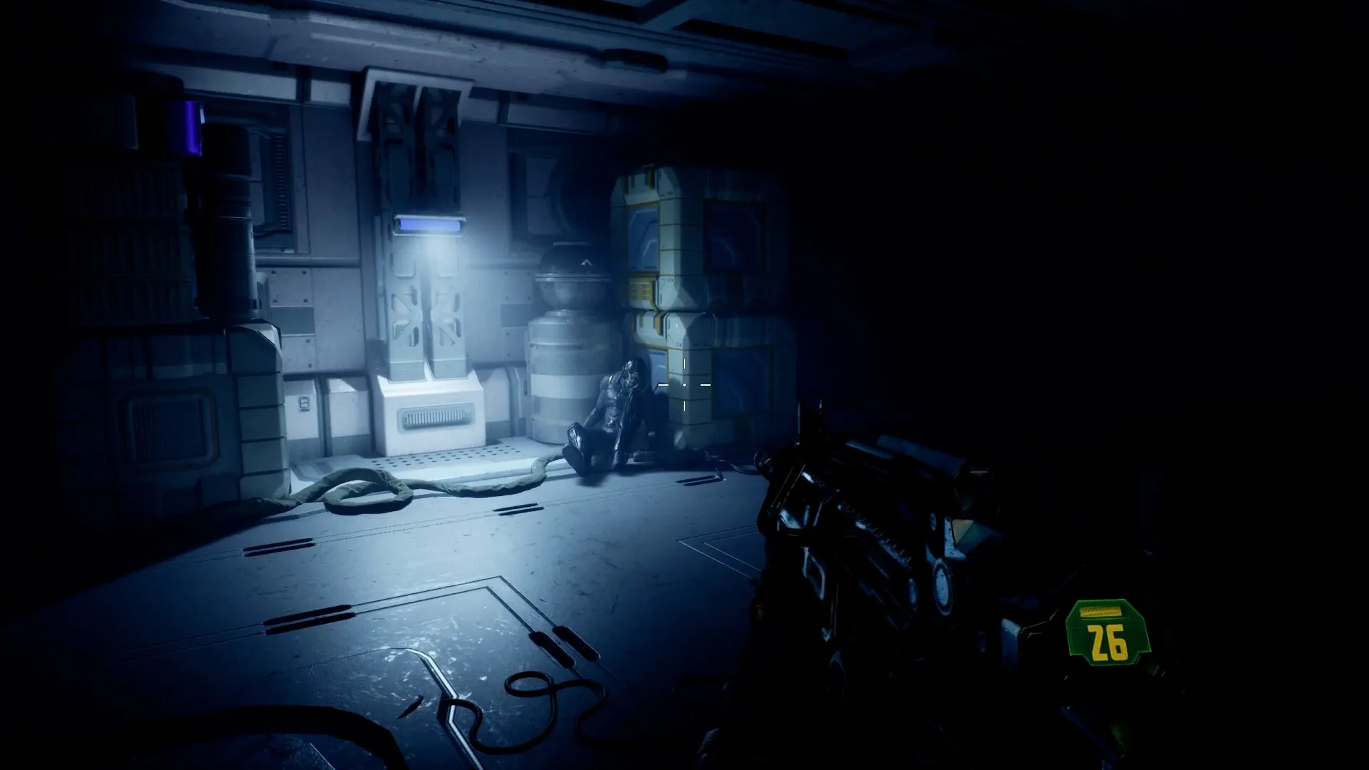 Deadzone: Player aiming at shadowy figure in dimly lit space corridor with crates and machinery