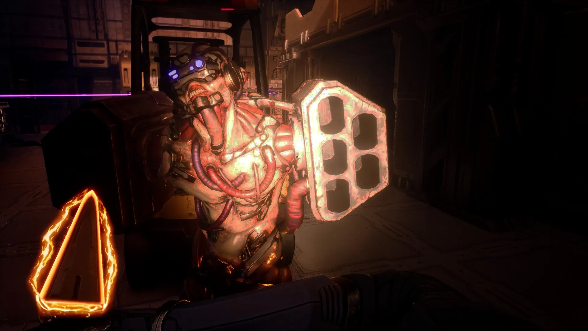 Deadzone: Enemy encounter in dimly lit corridor, alien with glowing shield approaches player character