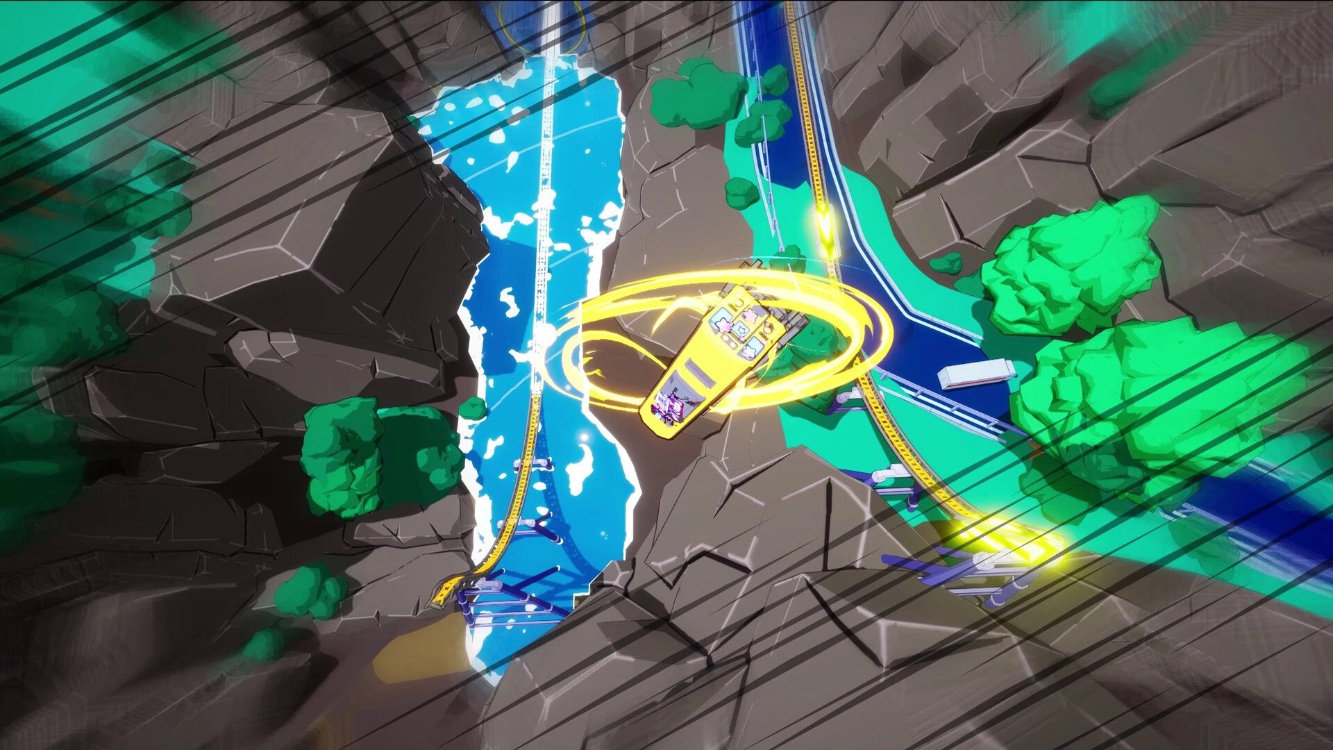 Denshattack!: Yellow train spins with glowing drift rings over canyon tracks beside a river and trees.