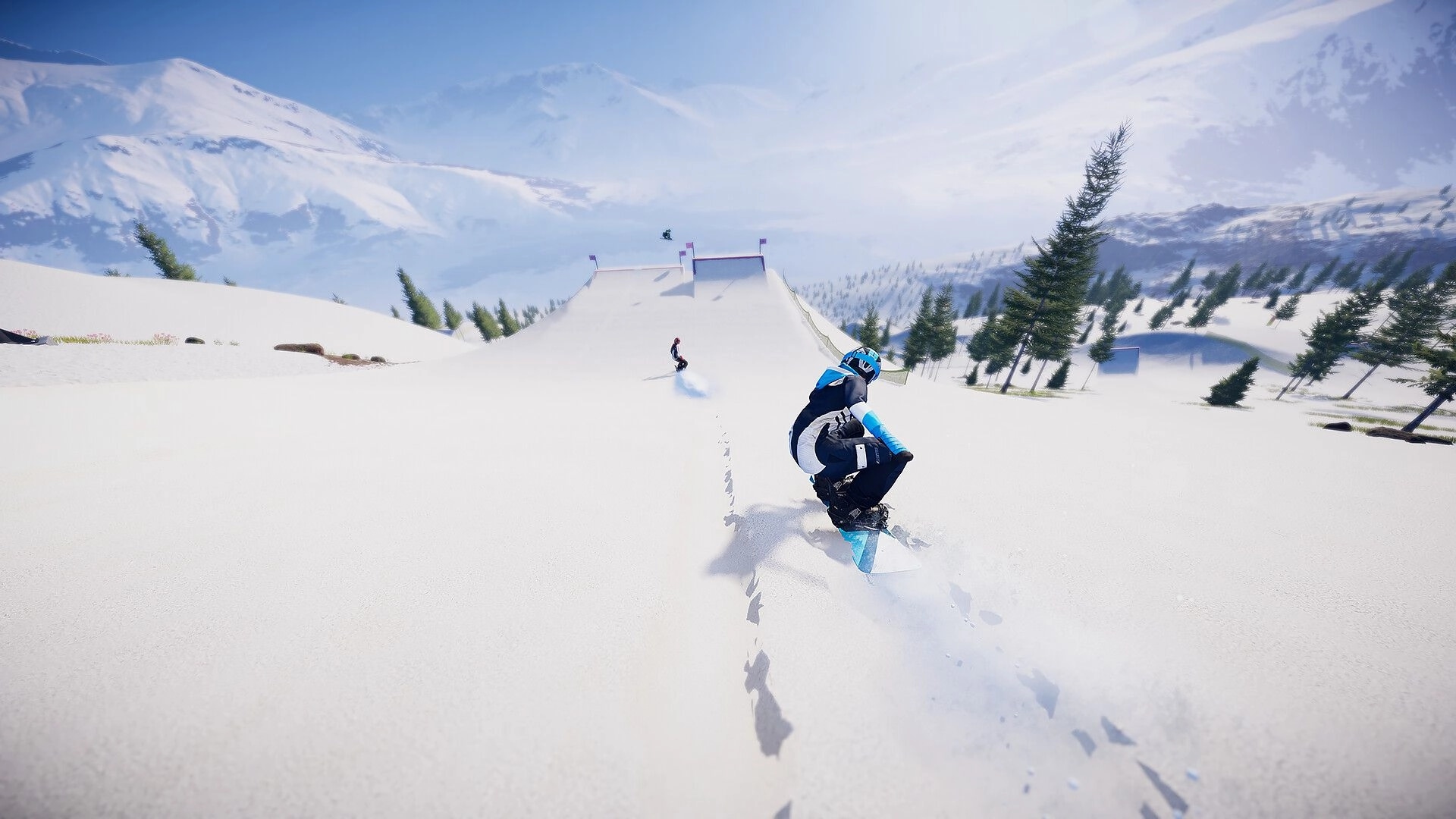 Descenders Next: Two snowboarders racing down a snowy mountain slope with distant peaks and trees
